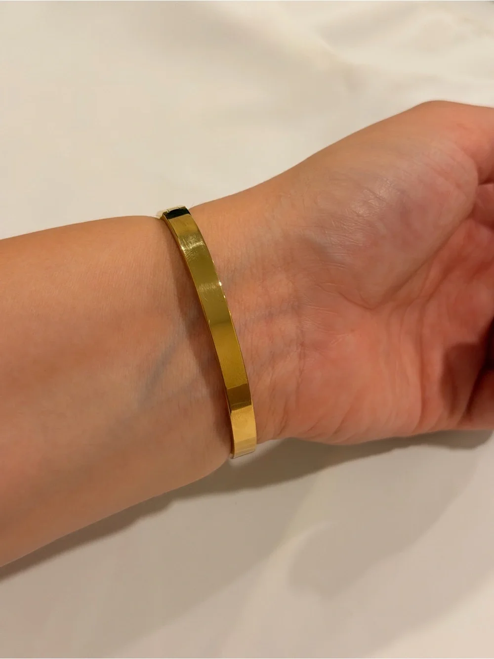 Gold Bangle with Emerald Green Accents